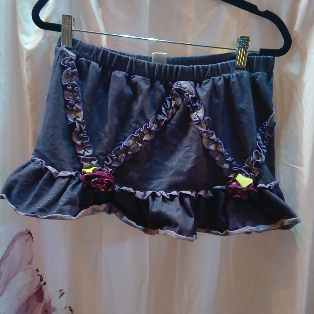 Girls size 10 purpleish short skirt with built in shorts  ruffles flower details